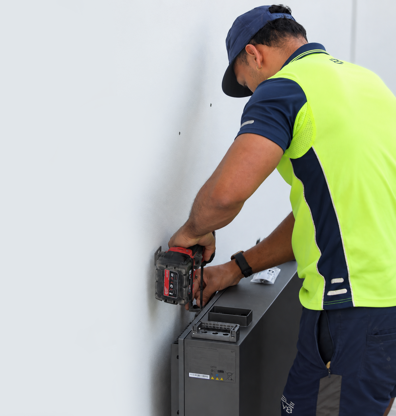 Sunbridge installer fitting a home battery system